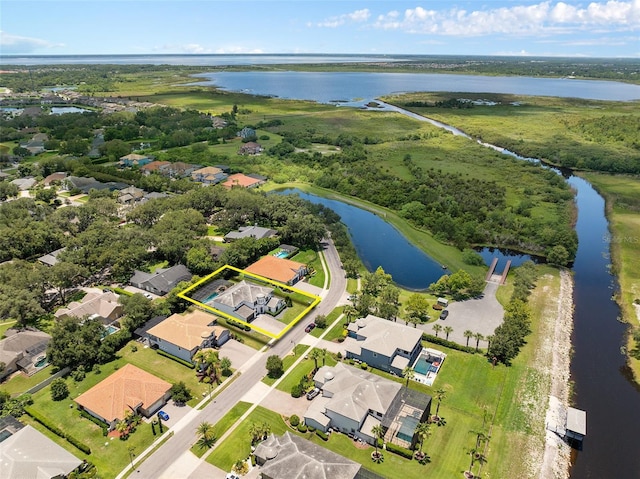 birds eye view of property with a water view