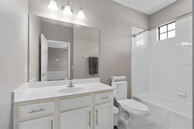 full bathroom with vanity, toilet, and tiled shower / bath