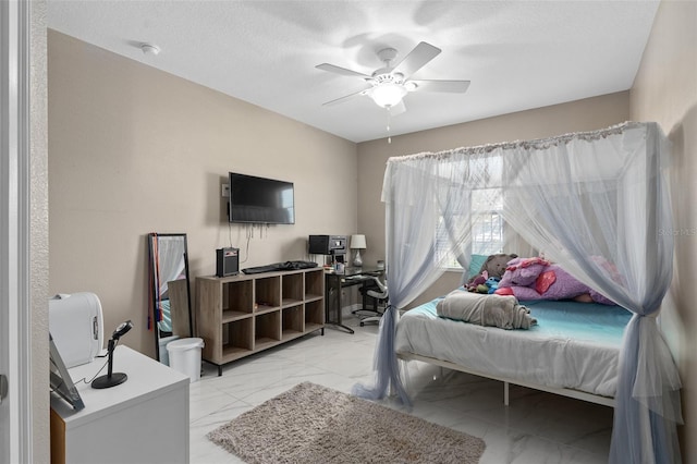 bedroom with a textured ceiling, marble finish floor, and a ceiling fan