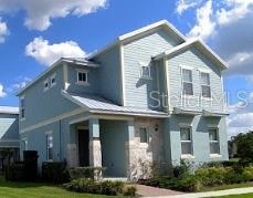 1481 Fairview Cir, Kissimmee, FL 34747 - view of front of house featuring a front yard