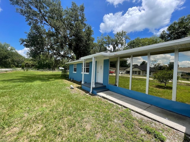 exterior space with a front yard