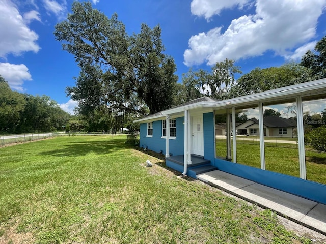 view of yard featuring covered porch