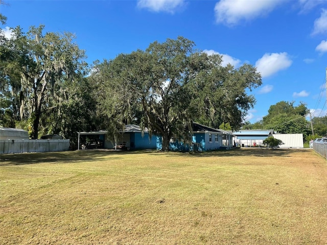 view of yard with a carport