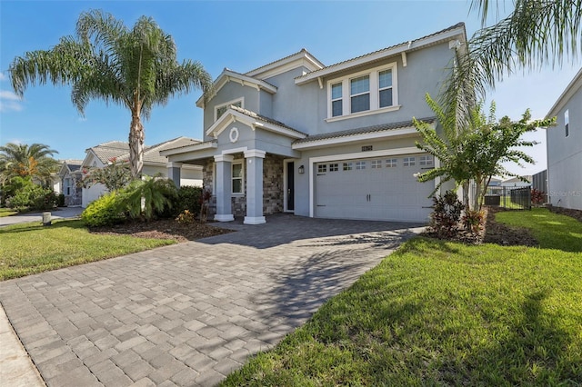 view of front of house featuring a front yard and a garage