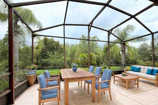 view of patio / terrace with an outdoor living space and glass enclosure