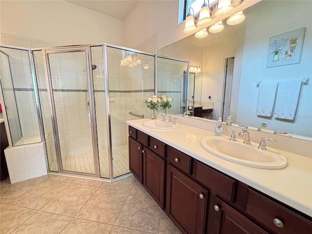 bathroom with vanity, tile patterned floors, and walk in shower