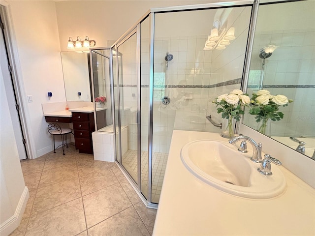 bathroom featuring tile patterned flooring, vanity, and walk in shower