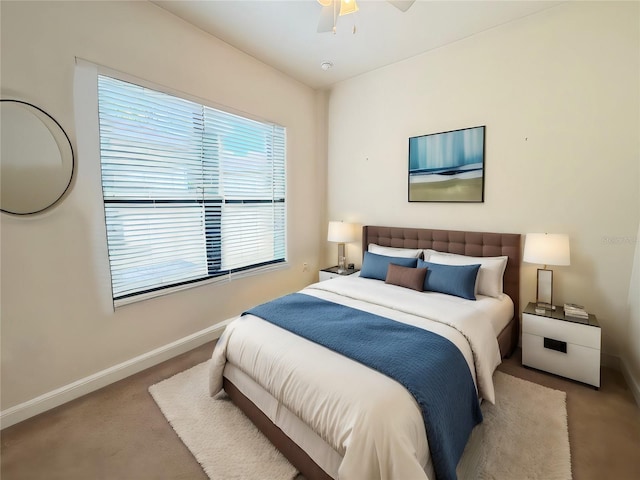 bedroom featuring ceiling fan and light colored carpet