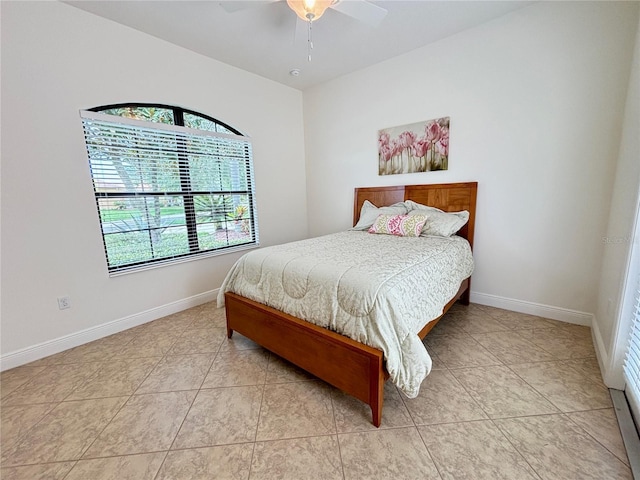 tiled bedroom with ceiling fan