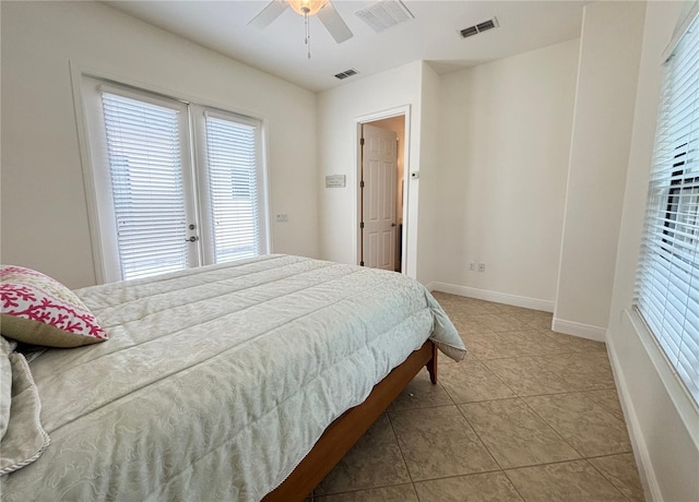 bedroom featuring light tile patterned floors and ceiling fan