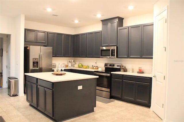 kitchen with a kitchen island and appliances with stainless steel finishes