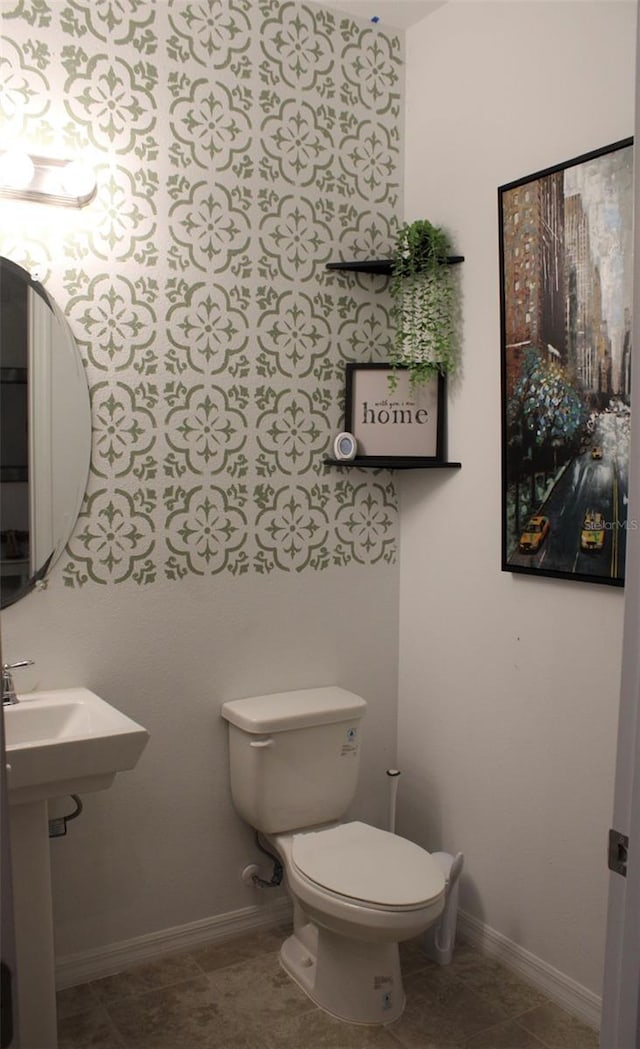 bathroom featuring tile patterned floors and toilet