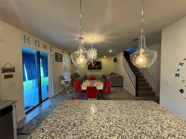 dining space with an inviting chandelier