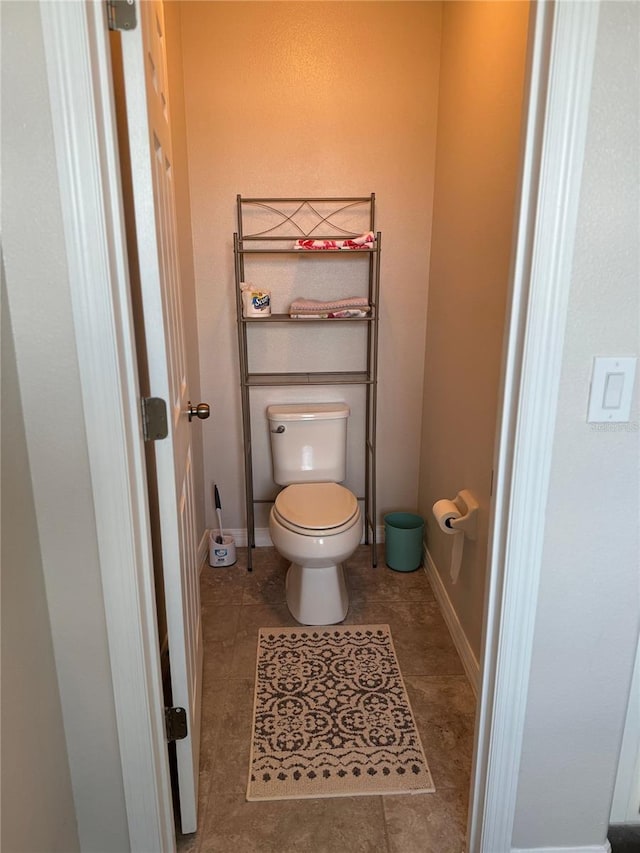 bathroom featuring tile patterned flooring and toilet