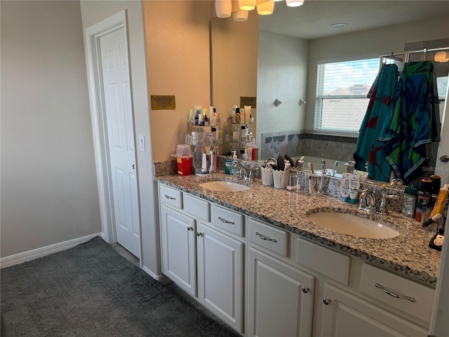 bathroom with a bathing tub and vanity