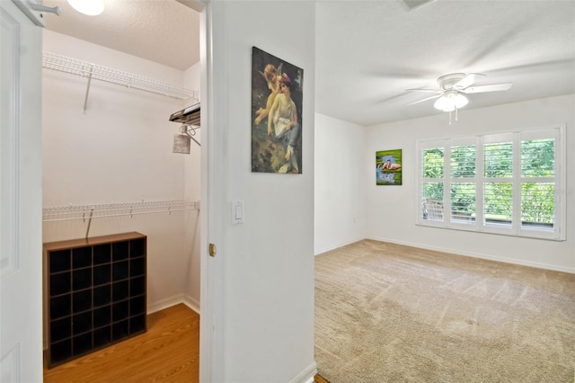 interior space featuring ceiling fan