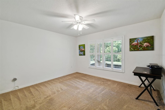 carpeted empty room with ceiling fan