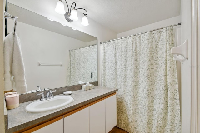 bathroom featuring vanity and a textured ceiling