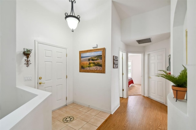 foyer with light wood-type flooring