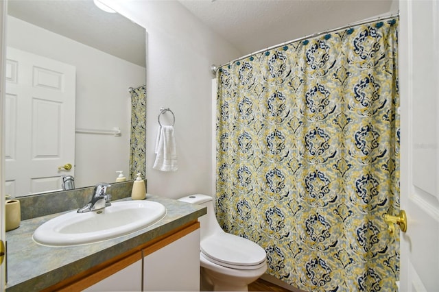 bathroom with vanity, a textured ceiling, toilet, and a shower with shower curtain