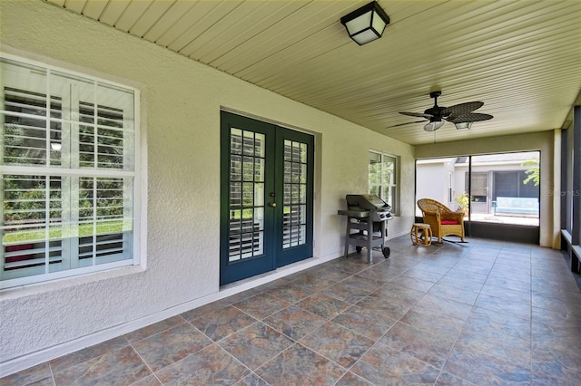 unfurnished sunroom with french doors and ceiling fan