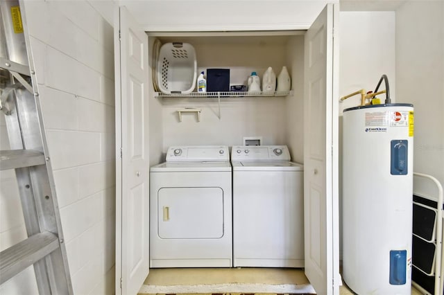 laundry area with separate washer and dryer and water heater