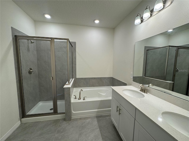 bathroom featuring shower with separate bathtub, tile patterned floors, a textured ceiling, and vanity