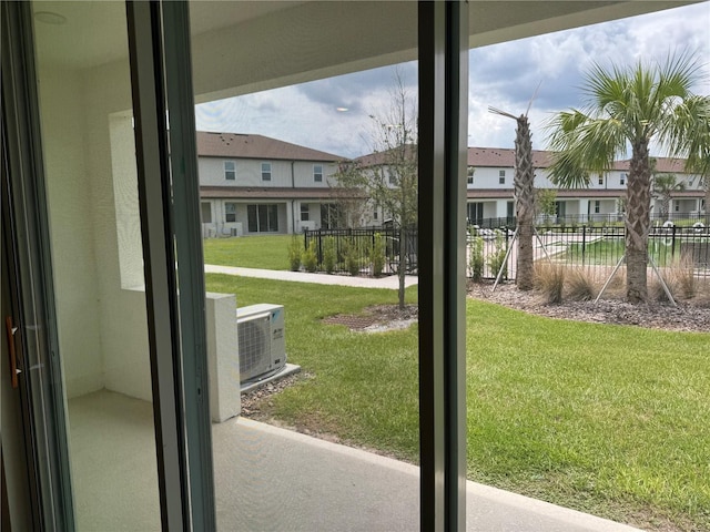 doorway to outside featuring ac unit