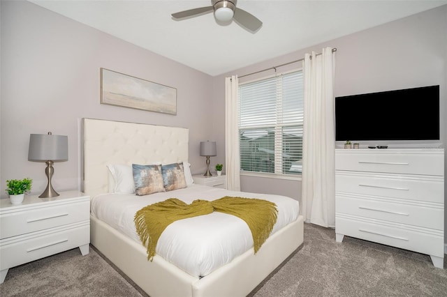 bedroom featuring dark colored carpet and ceiling fan