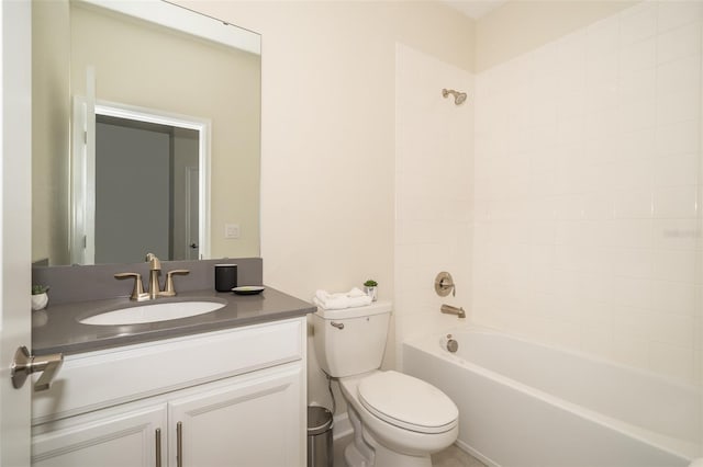 full bathroom featuring vanity, tiled shower / bath combo, and toilet