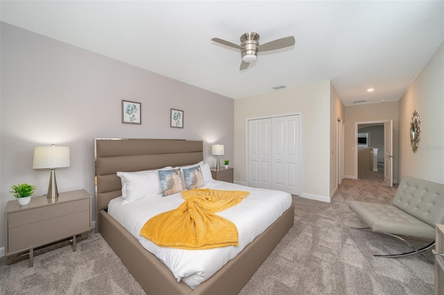 bedroom featuring ceiling fan, carpet, and a closet