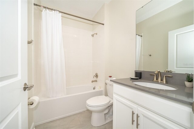 full bathroom with vanity, shower / bathtub combination with curtain, tile patterned flooring, and toilet