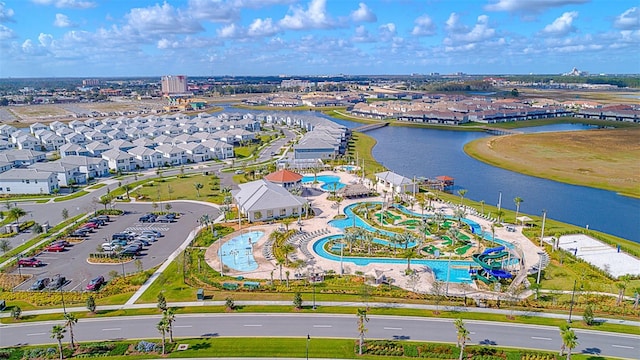 birds eye view of property with a water view