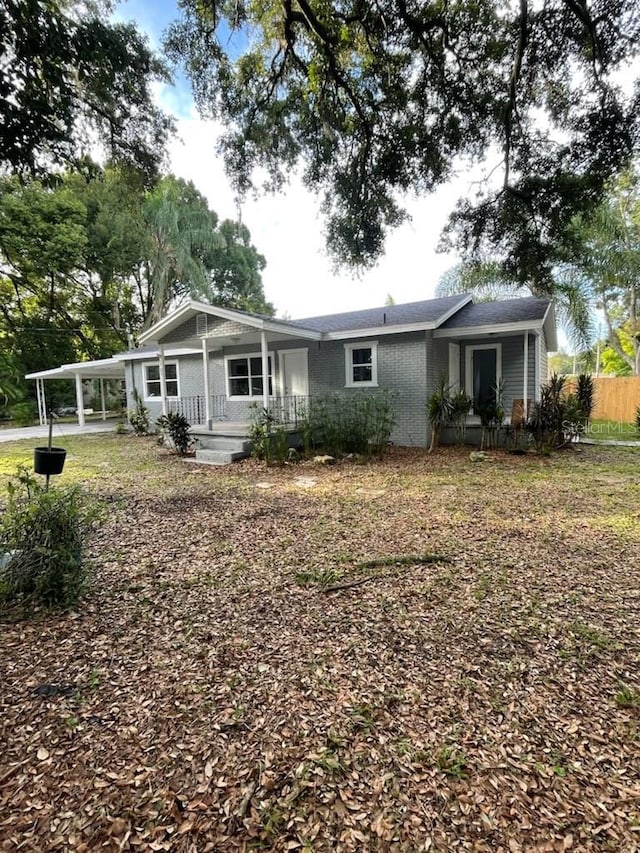 ranch-style home with a porch