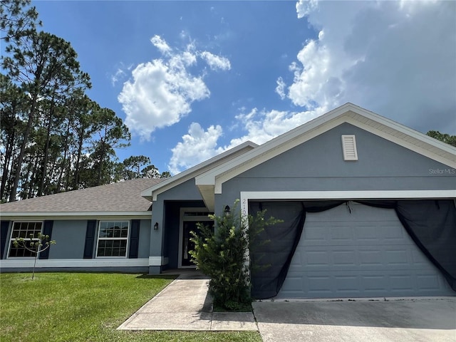 single story home with a garage, a shingled roof, concrete driveway, stucco siding, and a front lawn