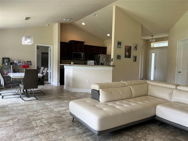 tiled living room with high vaulted ceiling