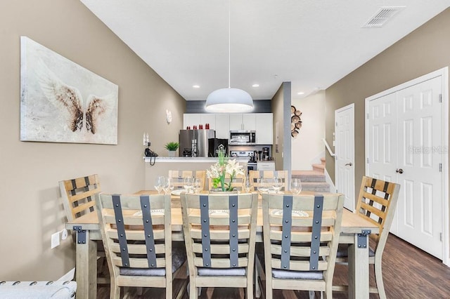 dining space with stairway, dark wood finished floors, visible vents, and recessed lighting