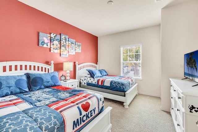 bedroom with light colored carpet