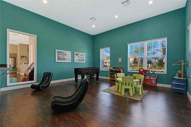 game room featuring wood finished floors, visible vents, and baseboards