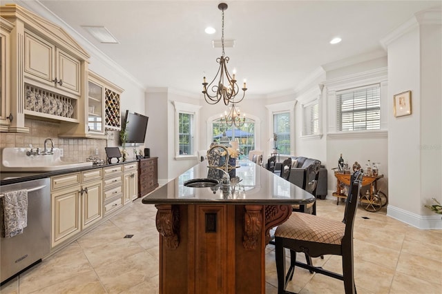 kitchen featuring light tile patterned floors, dishwasher, cream cabinetry, and tasteful backsplash