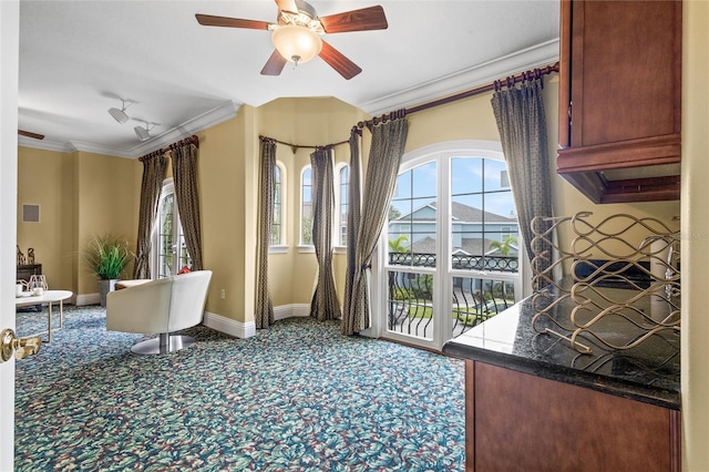 interior space featuring ornamental molding and ceiling fan