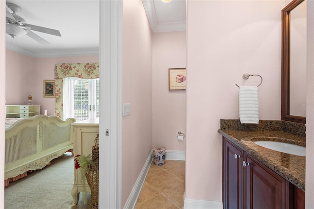 bathroom with ceiling fan, vanity, tile patterned flooring, and crown molding