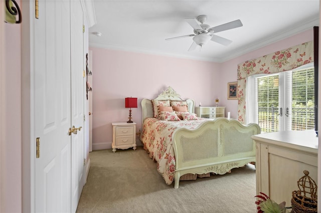 carpeted bedroom with ornamental molding, ceiling fan, and access to exterior