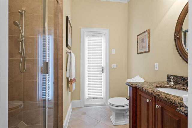 bathroom with a shower with door, tile patterned floors, toilet, vanity, and ornamental molding