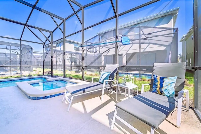 view of swimming pool featuring an in ground hot tub, a lanai, and a patio