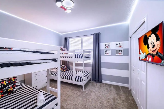 carpeted bedroom featuring a closet