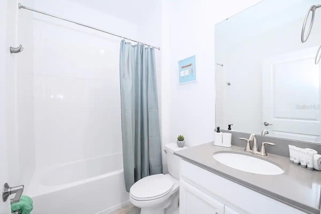 full bathroom featuring toilet, vanity, and shower / tub combo with curtain