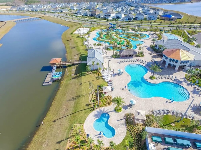 birds eye view of property featuring a water view