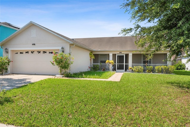 single story home with covered porch, a garage, and a front lawn