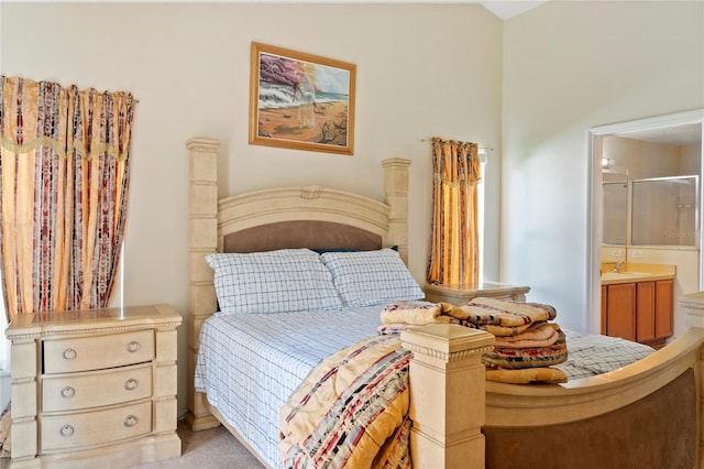 carpeted bedroom featuring sink and connected bathroom